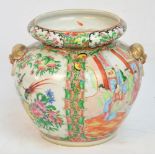 A 19th century Chinese Canton vase hand painted in Famille Rose enamels with figures and exotic