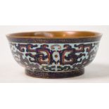 An unusual early 20th century Chinese enamel on copper bowl of ogee form, decorated with archaic