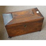 A Victorian rosewood sarcophagus shaped tea caddy with two leaded sections and a glass mixing bowl