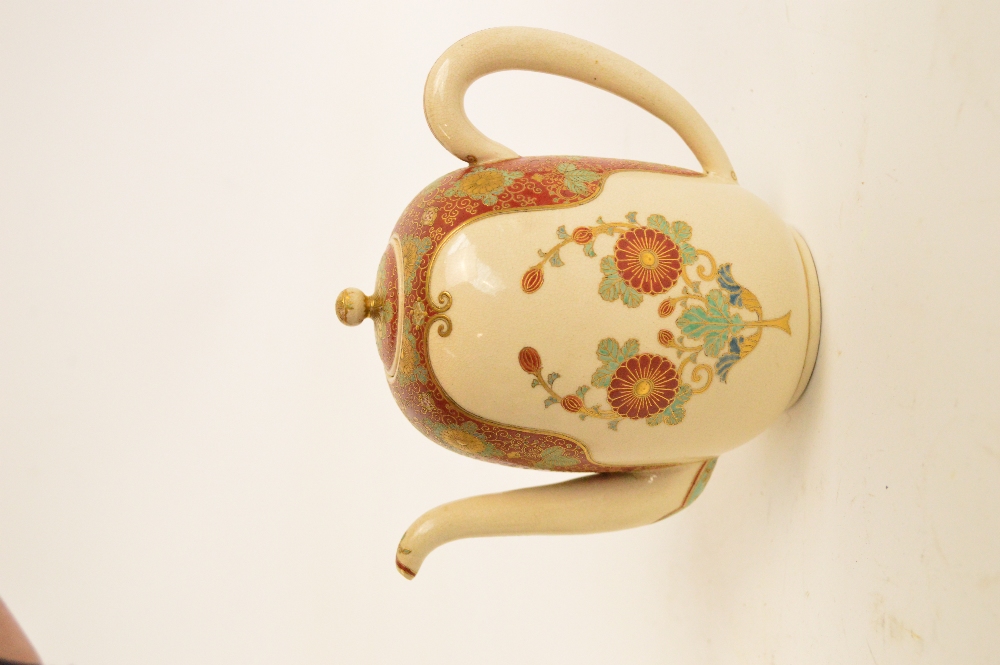 A Japanese Meiji period Satsuma teapot, the angled spout above floral decorated red and cream ground - Image 3 of 6
