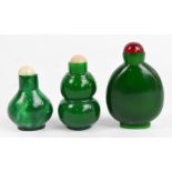 Three early 20th century Chinese green hardstone snuff bottles, one of double gourd form,