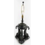 A large early 20th century bronze and veined marble table lamp with three grotesque fish supports,