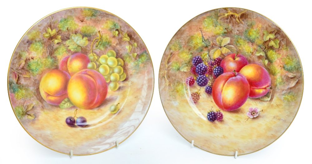 A pair of mid 20th century Royal Worcester porcelain cabinet plates painted with fruit by J Freeman,