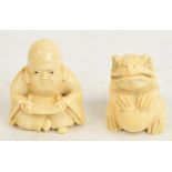 Two early 20th century Japanese carved ivory netsukes depicting a seated bearded man and a toad.