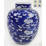 A large 19th century Chinese porcelain jar and cover, painted in underglaze blue with blossoming