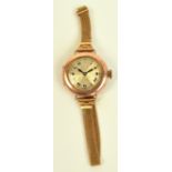 A 1920s 9ct gold cased lady's manual wind wristwatch, the circular dial set with Roman numerals,