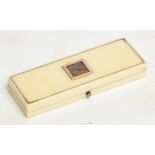 A Georgian ivory and gold inlaid rectangular toothpick case, the hinged lid set with a lock of