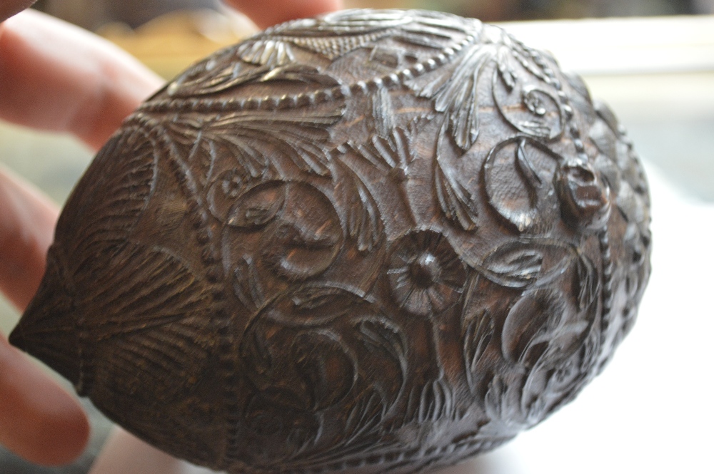 An unusual carved coconut with mask detail to the front and band of scrolling decoration with - Image 6 of 6
