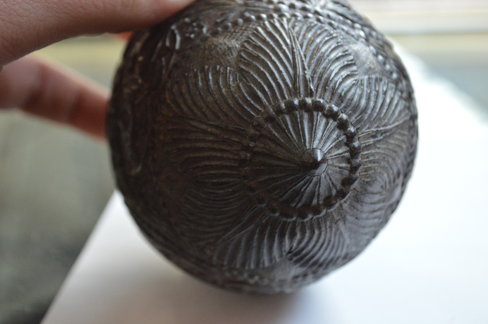 An unusual carved coconut with mask detail to the front and band of scrolling decoration with - Image 4 of 6