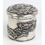 A late 19th century Japanese silver circular jar and cover, both cover and body decorated with