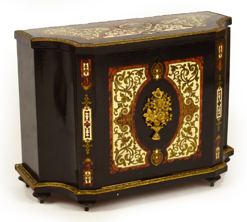 A 19th century French ebonised and Boullework writing cabinet, the hinged lid enclosing letter rack,