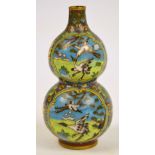 An early 20th century Japanese cloisonné double gourd vase set with four panels depicting