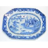 A c.1800 Chinese Export serving plate painted in underglaze blue with a landscape within floral