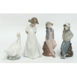 Two Nao figure depicting a girl in a white dress and a goose, also a pair of Nadal figures depicting