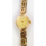 ACCURIST; a 9ct gold cased lady's wristwatch on a 9ct gold bracelet. CONDITION REPORT: Weight 10.