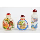 Three early 20th century Chinese milk glass snuff bottles, each painted in polychrome enamels,