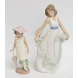 Two Nao figures of young girls, height 27cm and 19cm.