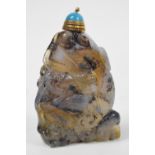 An early 20th century Chinese carved agate snuff bottle with gilt metal mounted stopper,