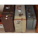 A strap bound vintage canvas suitcase and two further canvas cases (3).