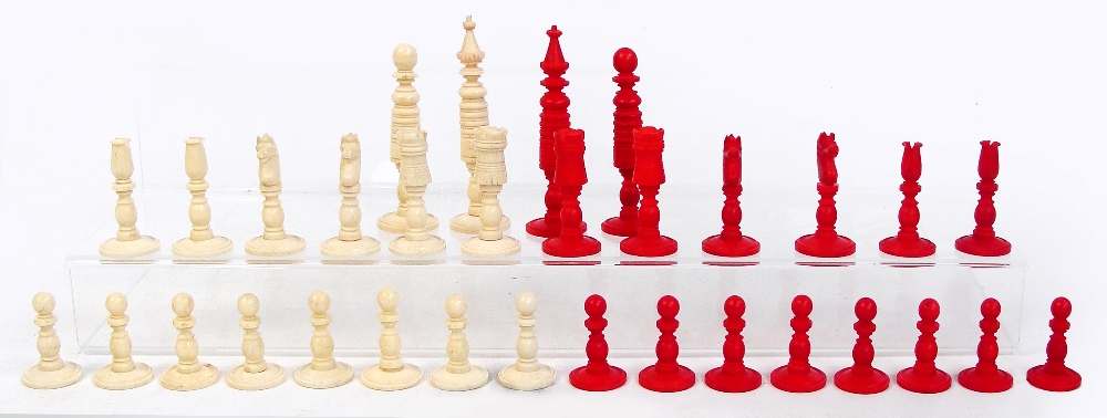 *Amended Description* An early 20th century turned bone and stained red bone chess set, height of