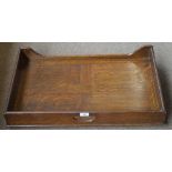 An Edwardian oak folding bed tray, width 70cm.