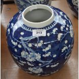 A late 19th century porcelain jar painted in underglaze blue with blossoming prunus,