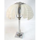 An Art Deco style chromed table lamp with fluted square section central column and associated