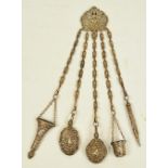 A late 19th century plated chatelaine suspending five implements comprising a thimble case,