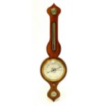 A Georgian mahogany four dial wheel barometer with traces of floral decoration, length 94cm.