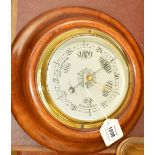 A walnut framed circular wall barometer retailed by Mappin & Webb Ltd, diameter 24cm.