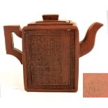 A 19th century Chinese Yixing rectangular teapot decorated to front and back with calligraphy with