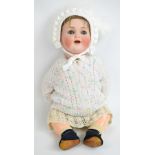 A large German bisque headed doll with composite limbs and body,