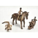 Three small fibre or leather made figures comprising a man on horseback with an axe,