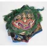 A late 19th/early 20th century Chinese child's dragon embroidered cap.