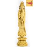 A finely carved 19th century Chinese ivory figure of Guanyin wearing an elaborate headdress and