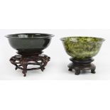 An early 20th century Chinese mottled green hardstone bowl of ogee form with straight circular foot,