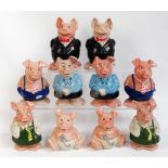 A collection of ten Wade Natwest piggy banks, two of each, nine with their Natwest plugs.