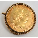 A George III spade guinea, 1788, in gold brooch mount, approx 10.8g.