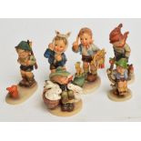 Six 1950's German Hummel figures including "Sensitive Hunter", "The Artist" etc.