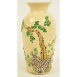 A Japanese Meiji period Satsuma baluster vase decorated in relief with a pine tree,