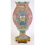 A 20th century Chinese porcelain Famille Rose hexagonal lantern with pierced body set with circular