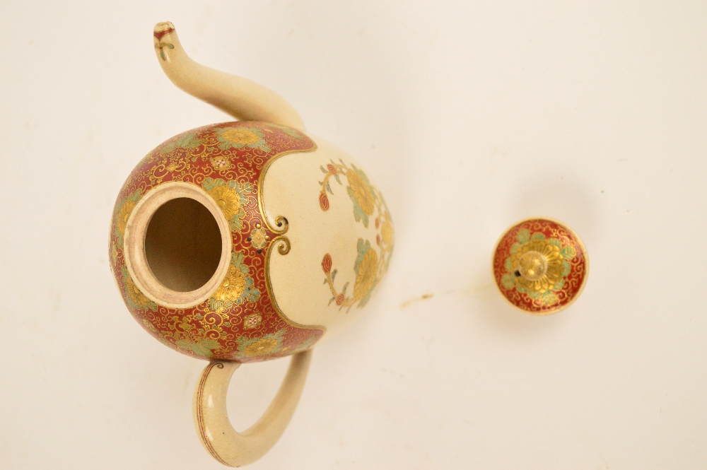 A Japanese Meiji period Satsuma teapot, the angled spout above floral decorated red and cream ground - Image 5 of 6