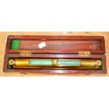 An early 20th century mahogany boxed brass surveyor's sliding spirit level by J Casartelli & Son,