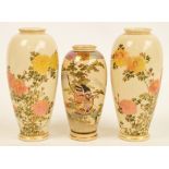 A pair of Japanese Meiji period Satsuma ovoid vases decorated with floral sprays, painted