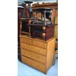 A mid 20th century oak chest of two over three drawers, a round oak occasional table,