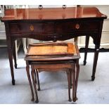 A reproduction mahogany serpentine front sideboard of small proportions on tapering legs,