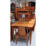 An Austin mid 20th century dining suite comprising extending dining table,