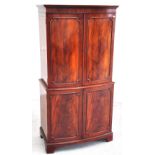 A reproduction flame mahogany drinks cabinet comprising two double internal sections with internal