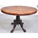 An early 20th century inlaid walnut tilt top table,