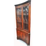 A reproduction serpentine front mahogany sideboard,